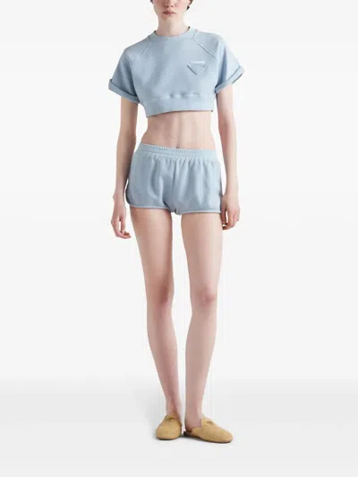 Prada Triangle-patch Jersey Mini Shorts In Blue