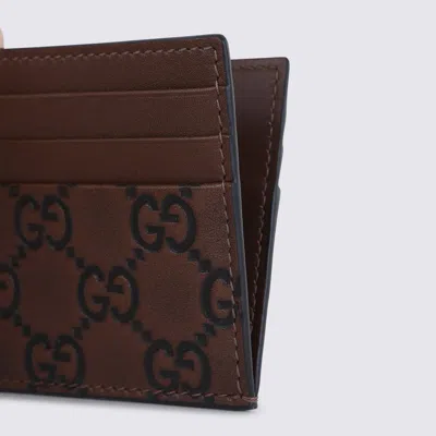 Gucci Gg Emblem Leather Compact Card Holder In Brown