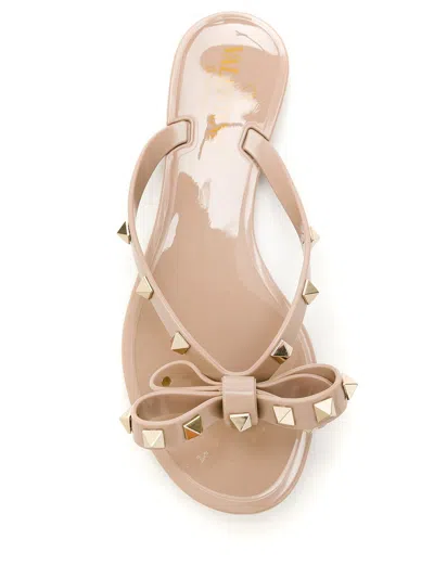 Valentino Garavani Mini Bow Sandals With Platinum-finish Studs And Thece Motif In Pink