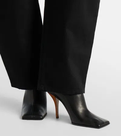 Alaïa 90 Leather Mules In Black