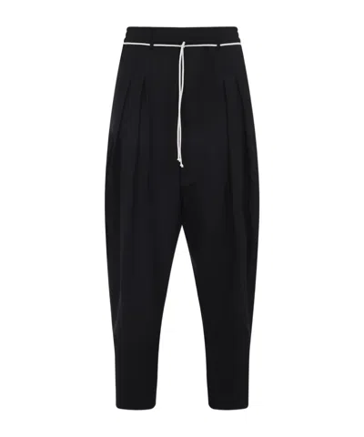 Mordecai Tapered Black Trousers With Pleated Front In Black