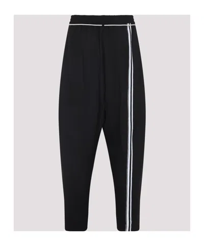 Mordecai Tapered Black Trousers With Pleated Front In Black