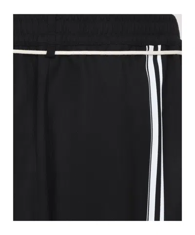 Mordecai Tapered Black Trousers With Pleated Front In Black
