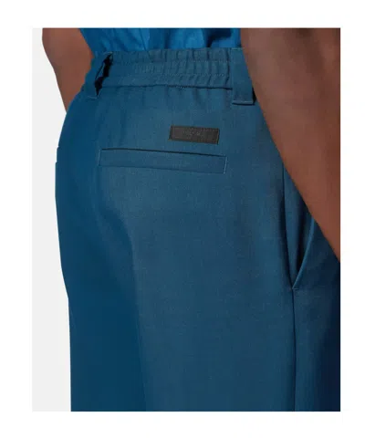 Versace Wool Jogger Pants In Blue