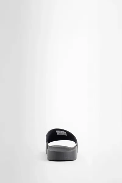 Balenciaga Embossed Logo Slip-on Sandals With Moulded Footbed In Black