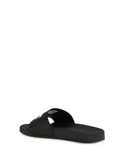 Balenciaga Embossed Logo Slip-on Sandals With Moulded Footbed In Black