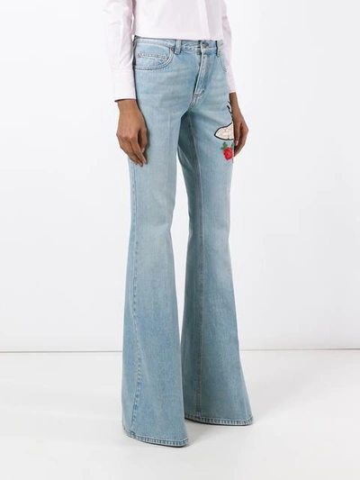 Shop Gucci Embroidered Flared Denim Jeans In Blue