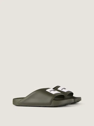 Givenchy Label Slide Flat Mules In Rubber In Green