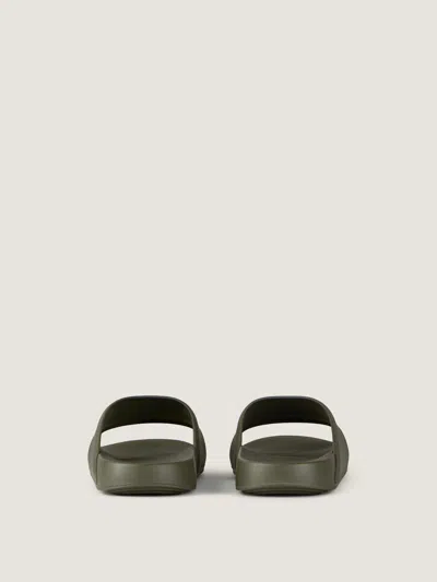 Givenchy Label Slide Flat Mules In Rubber In Green