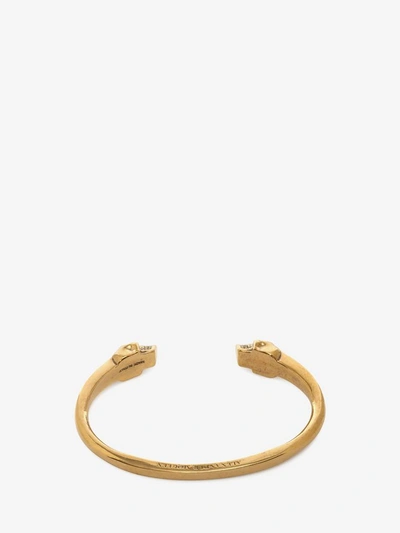 Shop Alexander Mcqueen Twin Skull Bracelet In Wood & Gold