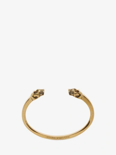 Shop Alexander Mcqueen Twin Skull Bracelet In Wood & Gold