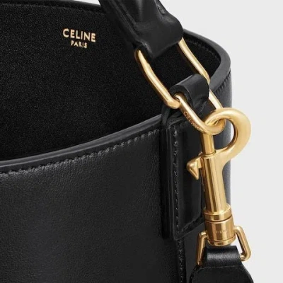 Celine Women Louise Medium Bucket Bag With Metal Triomphe Logo In Black