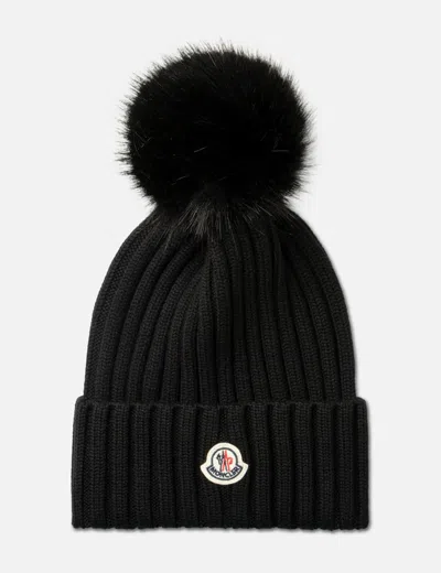Moncler Ribbed Knit Wool Beanie With Faux Fur Pom-pom In Black