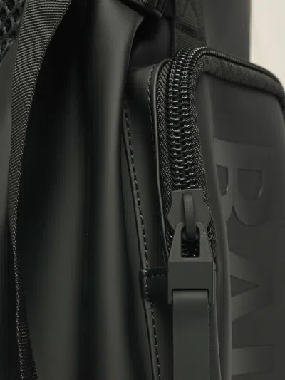 Rains Logo-print Multi-pocket Backpack In Black