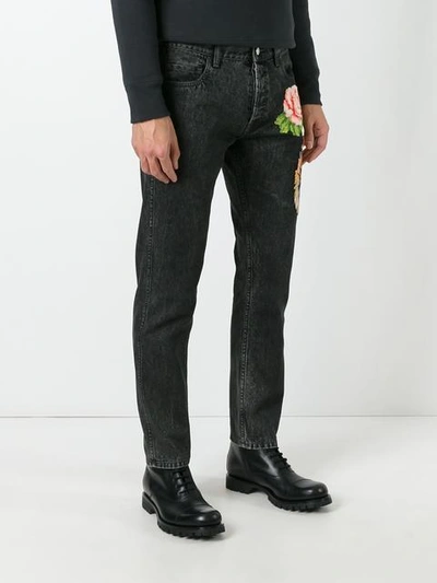 Shop Gucci Tiger And Floral Appliqué Tapered Jeans In Black