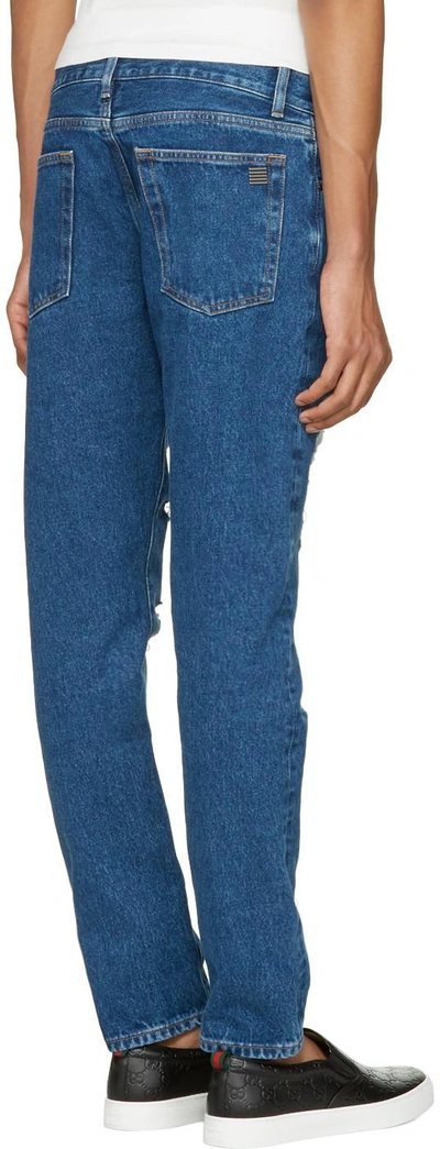 Shop Palm Angels Blue Ripped Jeans