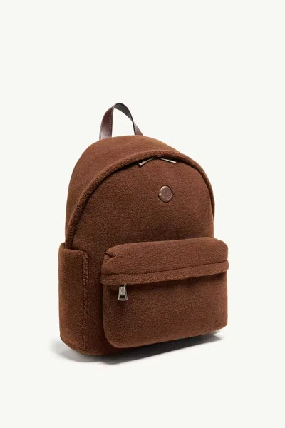 Moncler Logo Patch Zipped Backpack In Brown