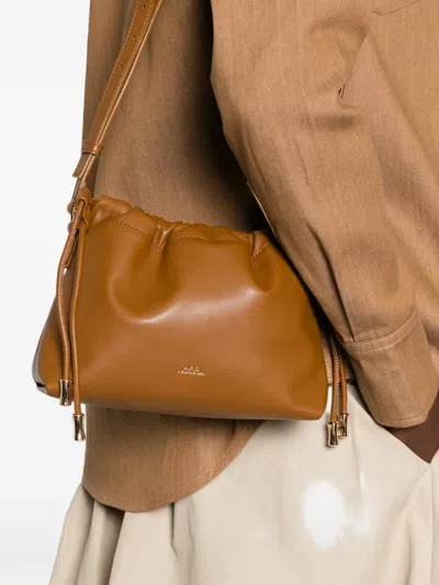 A.p.c. A. P.c. Ninon Drawstring-fastening Shoulder Bag In Orange