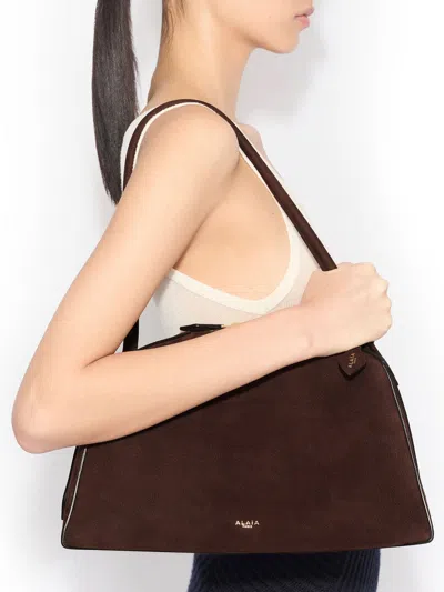 Alaïa Le Bouledogue Bowling Shoulder Bag In Nubuck Leather In Brown