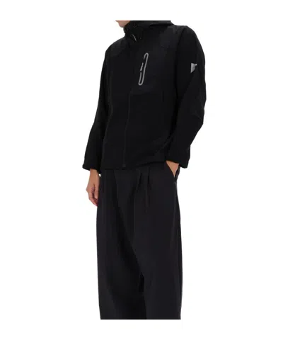 And Wander Stretch Shell Jacket In Black