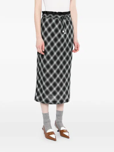 Less Plaid Midi Skirt In Black