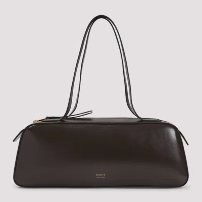 Khaite Simona Crackle Patent Elongated Tote Bag In Brown