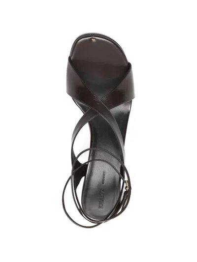 Khaite Liria Leather Crisscross Wrap Ankle-strap Sandals In Black