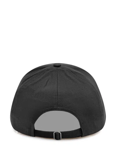 Moncler Logo Patch Curved Peak Baseball Cap In Black