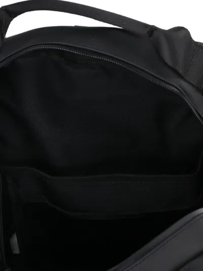 Rains Clip Front Backpack In Black