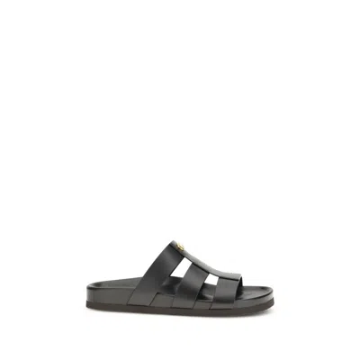 Valentino Garavani Studshield Logo-embellished Leather Sandals In Black