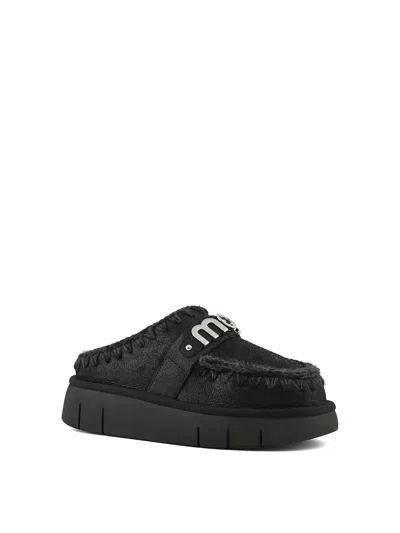 Mou Moccasin-inspired Black Slip-on Ankle Boots With Whipstitch Detailing In Black