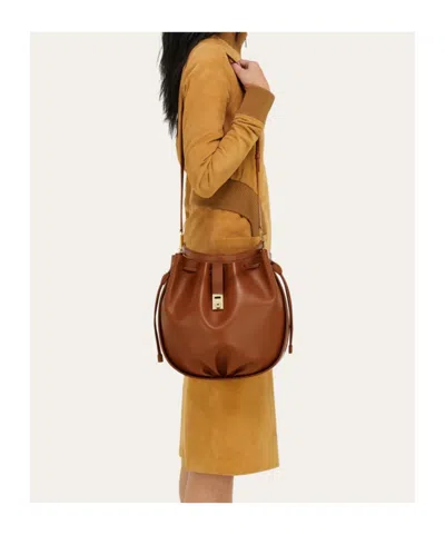 Ferragamo Hug Buckle Leather Bucket Bag In Brown