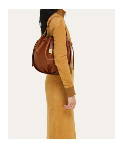 Ferragamo Hug Buckle Leather Bucket Bag In Brown
