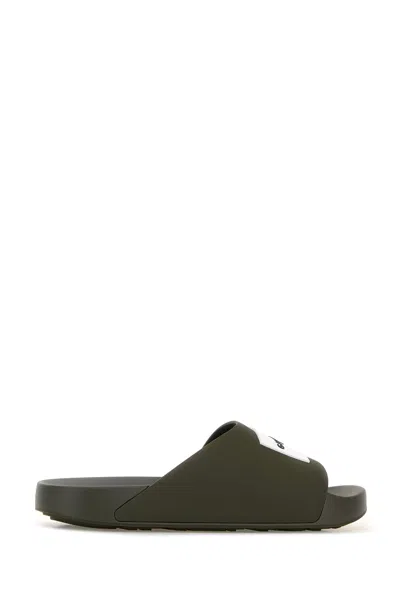 Givenchy Label Slide Flat Mules In Rubber In Green