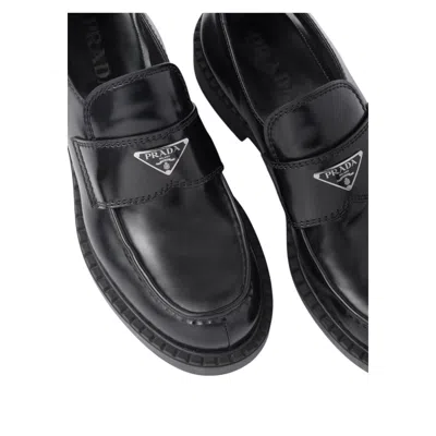 Prada Triangle Logo Brushed Leather Loafers In Black