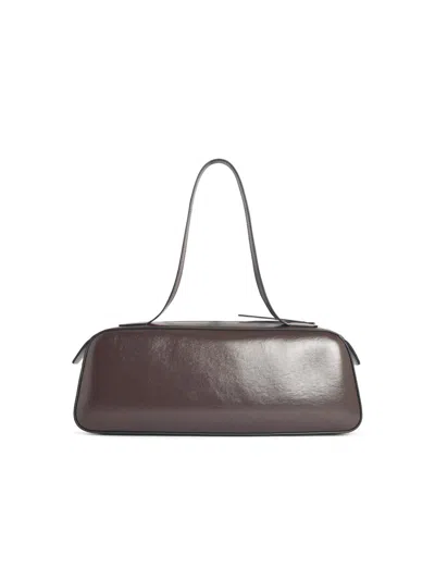 Khaite Simona Crackle Patent Elongated Tote Bag In Brown
