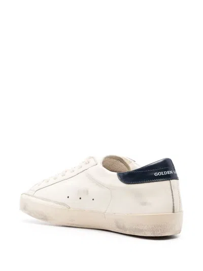 Golden Goose Super-star White Low Top Sneakers With Embossed Logo And Contrasting Heel Tab In Leather Man In Black