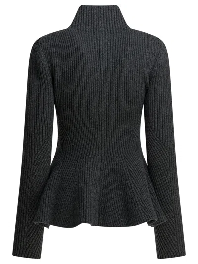 Alaïa Ribbed Wool And Cashmere-blend Peplum Zip-up Cardigan In Black