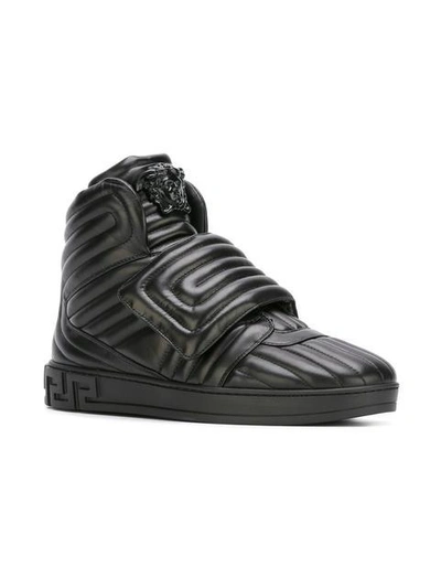 Shop Versace Palazzo Medusa Quilted Hi-top Sneakers - Black