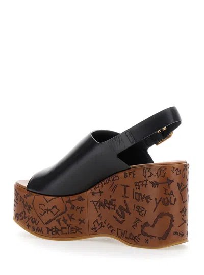Chloé Maxime Black Wedge With Engraved Written Decorations And Logo Buckle In Leather Woman