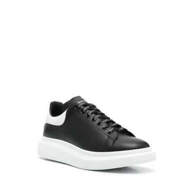 Alexander Mcqueen Black Low Top Sneakers With Logo Lettering On The Tongue In Leather Man
