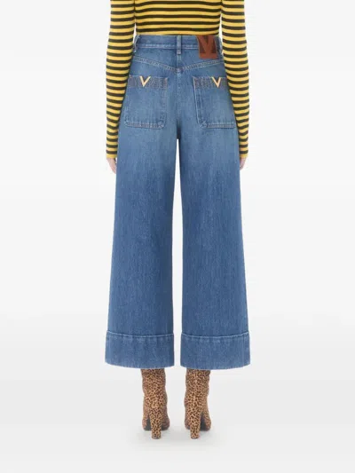 Valentino Cuffed Ankle Jeans With Front Button And Zip Closure In Blue
