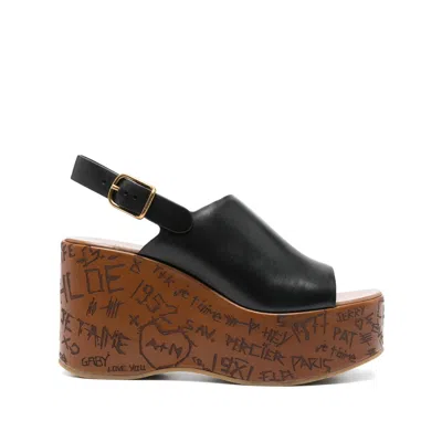Chloé Maxime Black Wedge With Engraved Written Decorations And Logo Buckle In Leather Woman In Black