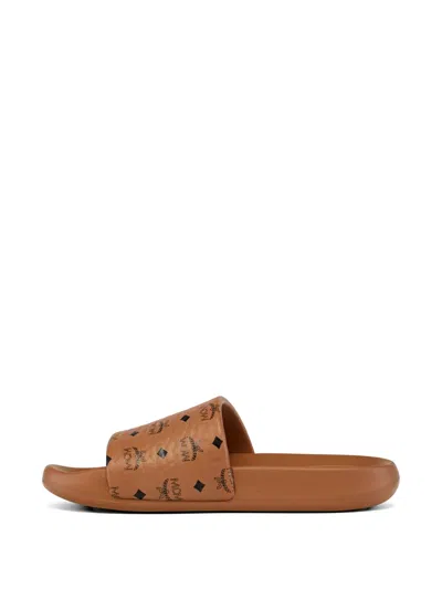 Mcm Male Monogram Print Rubber Slides In Brown