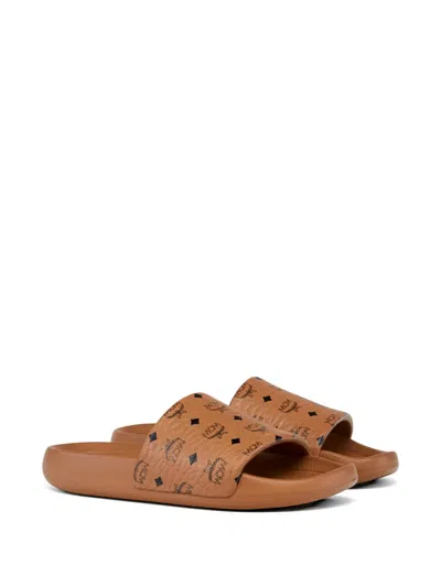 Mcm Male Monogram Print Rubber Slides In Brown