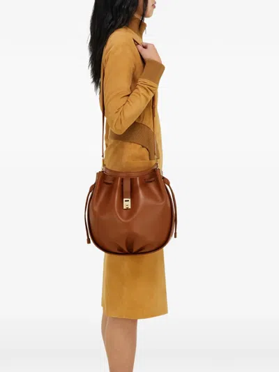Ferragamo Hug Buckle Leather Bucket Bag In Brown