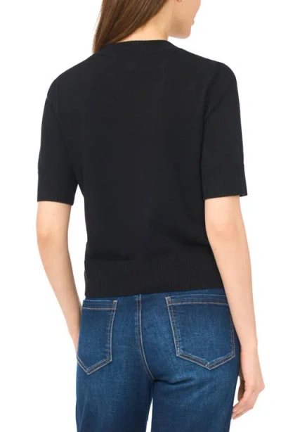 Cece Covered Button Short Sleeve Cardigan In Black