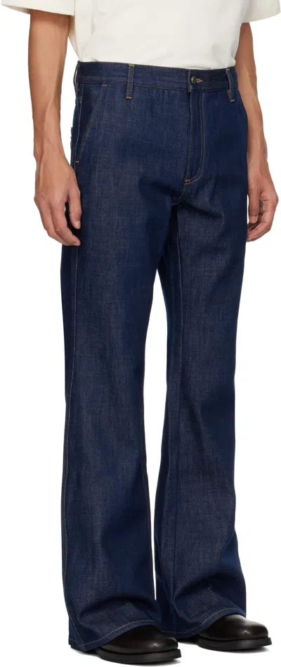 Amiri Raw Boot Cut Jeans In Blue
