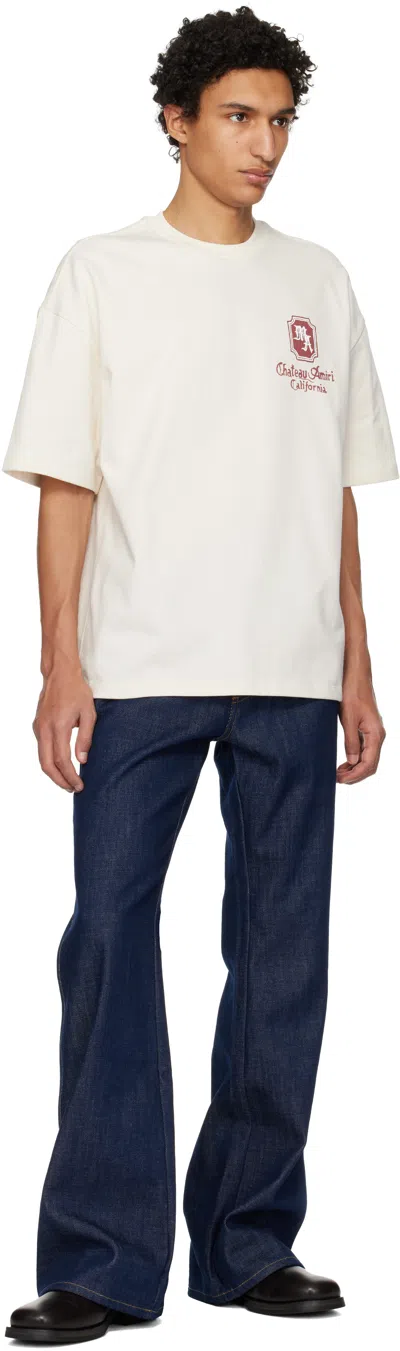 Amiri Raw Boot Cut Jeans In Blue