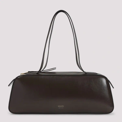 Khaite Simona Crackle Patent Elongated Tote Bag In Brown
